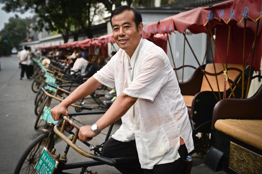 El conductor de rickshaw Cao Junlai en la zona de Shichahai de Pekín, el 12 de septiembre de 2014.
