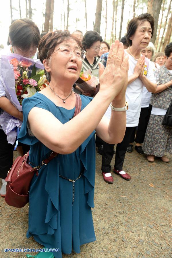 Huérfanos  japoneses de la  guerra visitan tumbas de sus  padres adoptivos chinos 4