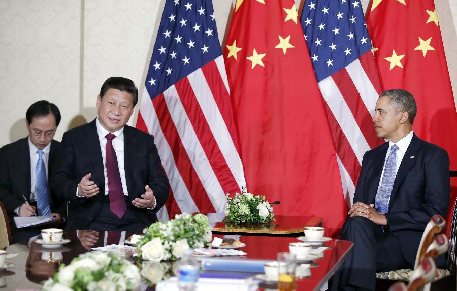 El presidente chino Xi Jinping (derecha) se reúne con el presidente de Estados Unidos Barack Obama en la Haya, Países Bajos, el 24 de marzo de 2014. Xi Jinping se reunió con Barack Obama al margen de la Cumbre de Seguridad Nuclear. [Foto/Xinhua]