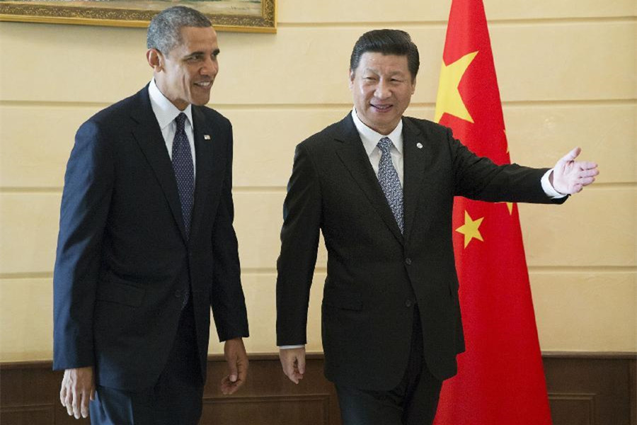 El presidente chino Xi Jinping (derecha) se reúne con el presidente de EE.UU  Barack Obama en San Petersburgo, Rusia, el6 de septiembre de 2013. Xi Jinping mantuvo conversaciones con Barack Obama al margen de la VIII Cumbre del G20. [Foto/Xinhua]