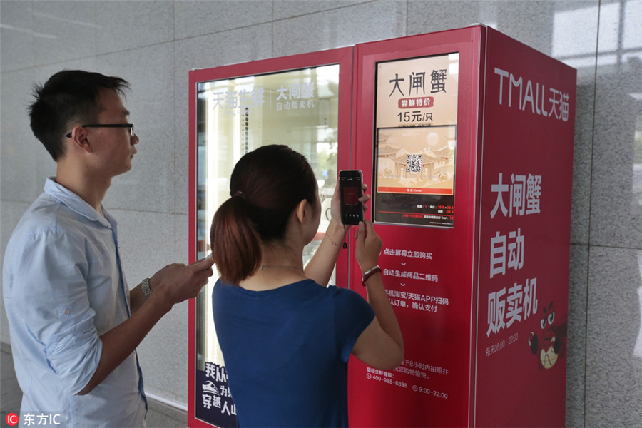 Los consumidores corren hacia la máquina que expende cangrejos peludos de Yangcheng