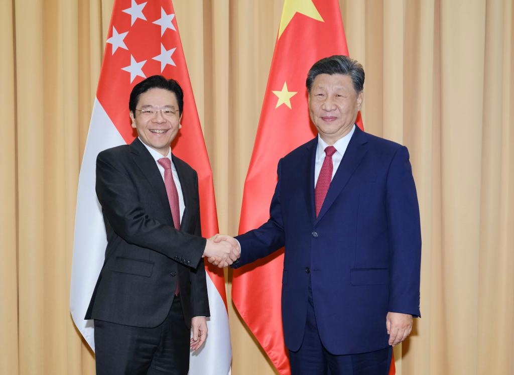 El presidente chino, Xi Jinping, se reúne con el primer ministro de Singapur, Lawrence Wong, al margen de la 31ª Reunión de Líderes Económicos de APEC, en Lima, Perú, el 15 de noviembre de 2024. (Xinhua/Ding Lin)